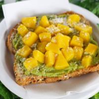 Mango Avocado Toast · Sprouted organic whole grain bread, guacamole mash, mango chunks, lime juice, coconut flakes.