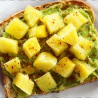 Pineapple Avocado Toast · Guacamole mash on sprouted organic bread; topped with pineapple chunks, fresh lime juice & T...