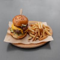 The LT Signature Burger · american cheese, bacon jam, brandied mushrooms, garlic aioli and pickles. Hand cut fries.