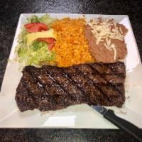 Carne Asada Dinner · Skirt steak, rice, beans, lettuce, tomato, avocado and a side of tortillas.