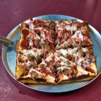 Meatzilla Pizza · Pepperoni, sausage, bacon, ham, ground beef and salami with pizza sauce and our signature ho...