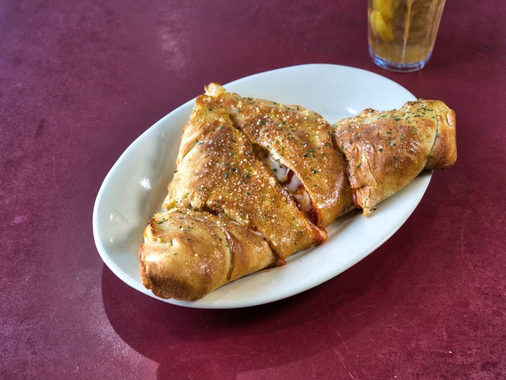 Build Your Own Calzone · Your choice of 2 toppings with our house cheese blend and our house pizza sauce. Blessed with fresh garlic and Parmesan for no additional charge.