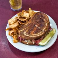 Corktown Reuben Sandwich · Our slow cooked melt in your mouth corned beef brisket sliced thin and piled to the sky! Smo...
