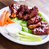 Jumbo Wings · Breaded wings, BBQ or Buffalo style, with celery and carrot sticks. Bleu cheese or ranch dre...