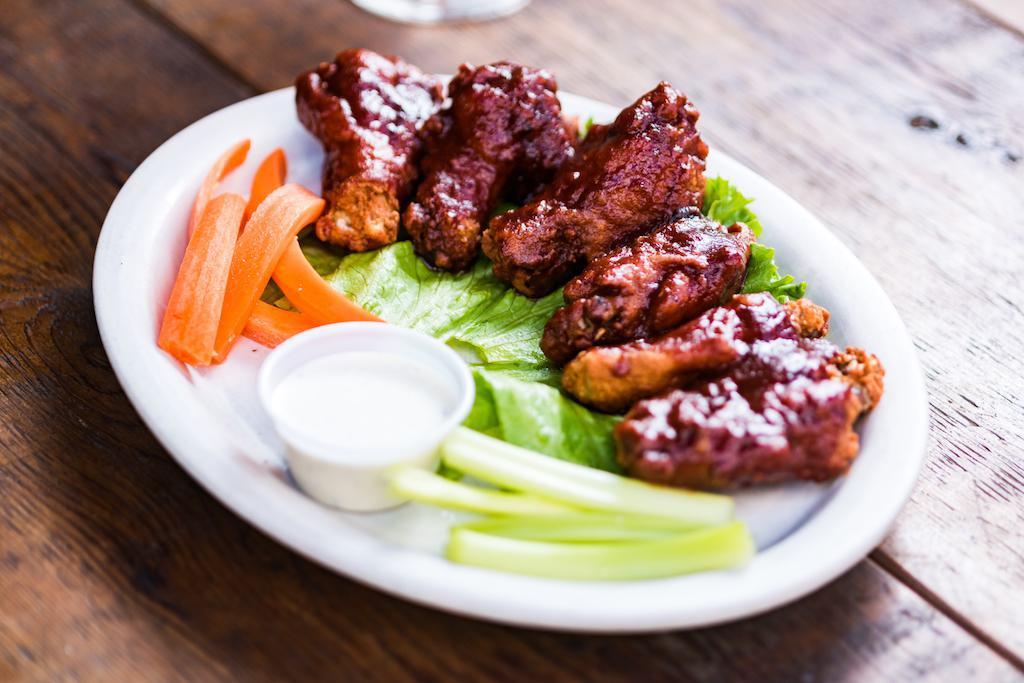 Jumbo Wings · Breaded wings, BBQ or Buffalo style, with celery and carrot sticks. Bleu cheese or ranch dressing on the side.