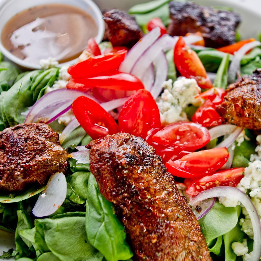 Black and Bleu Salad · Fresh spinach topped with choice of blackened chicken or steak, red onions, tomatoes and bleu cheese crumbles with balsamic vinaigrette on the side.