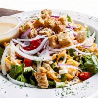 House Salad · Leafy greens with shredded cheese, red onions, tomatoes and croutons. Choice of dressing on ...