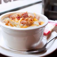 Potato Bacon Soup · Hearty potato chunks with bacon, carrots and celery in a cream base. Topped with shredded ch...