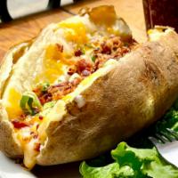 Loaded Baked Potato · Stuffed with cheddar and jack cheese, bacon and chives. Sour cream and butter on the side.