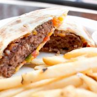 Quesadilla Burger · Your choice of patty between two flour tortillas with melted mixed cheeses, pico de gallo an...