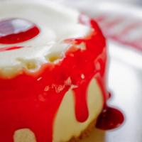 Cheesecake · New York-style cheesecake in the round topped with your choice of caramel or raspberry sauce.