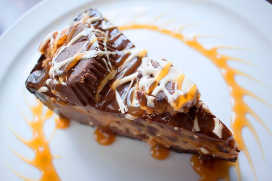 Chocolate Peanut Butter Pie · Peanut butter mousse and milk chocolate on a chocolate cookie crust. Topped with chocolate, caramel, Reese’s peanut butter cups and peanut butter drizzle.