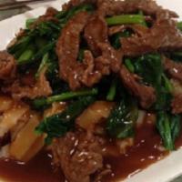 Beef Chow Fun with Sauce · Stir-fried vegetables and noodles.