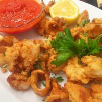 Fried Calamari · Breaded calamari with a marinara sauce basil broth,