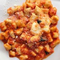 Homemade Potato Gnocchi · In tomato sauce topped with fresh mozzarella.