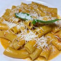 Rigatoni Alla Vodka · In a pink tomato sauce finished with Parmesan cheese.