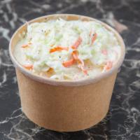 Cole Slaw  · Finely shredded raw cabbage and carrotz mixed in a mayonnaise dressing.