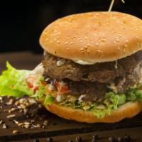 Double Burger · Double meat, lettuce, tomato, cheese, crushed chips, pineapple and sauces.