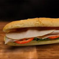 Pavo Sandwich · Turkey, lettuce, tomato and garlic sauce and cheese.