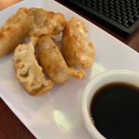 Dumplings · Only available fried, served with a side of ginger sauce.
