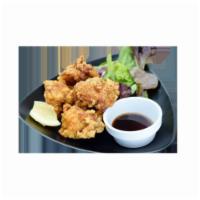 Crispy Chicken · 
Juicy fried chicken thigh with an original garlic pepper served with mixed baby greens and ...