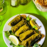 Stuffed Grape Leaves · 5 pieces. Vine grape leaves stuffed with rice, herbs, lemon juice and pine nuts. Contains nu...
