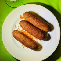 Turkish Style Kibbeh · 3 pieces. Bulgur stuffed with ground meat and special seasonings.