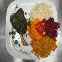 Incik Kebabi · Lamb shank. Stewed leg of lamb served with fried eggplant, red pepper, tomato and white rice.