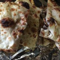 Keema Naan · Homemade and instantly baked in clay oven. Naan stuffed with ground meat delicately spiced b...