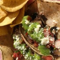 Portobello Mushroom Tacos · Tacqueria guac, pico & queso fresco in two soft our served with minted rice, blackbeans, cre...