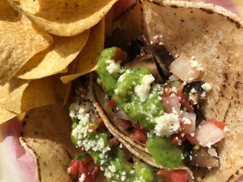 Portobello Mushroom Tacos · Tacqueria guac, pico & queso fresco in two soft our served with minted rice, blackbeans, crema agria and a handful of chips.