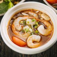 04. Tom Yumm · Chicken broth based in a mix of spices with green onions, mushroom, white onions, tomatoes, ...