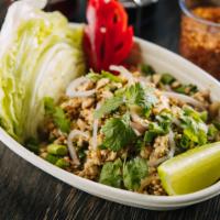 09. Laab Salad · Ground Chicken or Beef mixed in a savory and sour sauce with mint, green onions, red onions,...