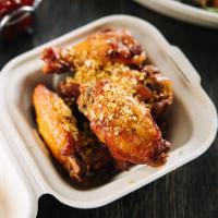 12. Crispy ZAAP Wings (5pc) · Savory soy garlic chicken wings topped with fried garlic.