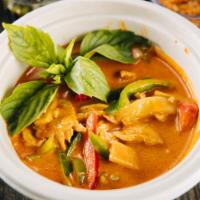 16. Red Curry · Creamy red curry with Thai basil, peas, bamboo, & bell peppers. Served with Jasmine Rice.