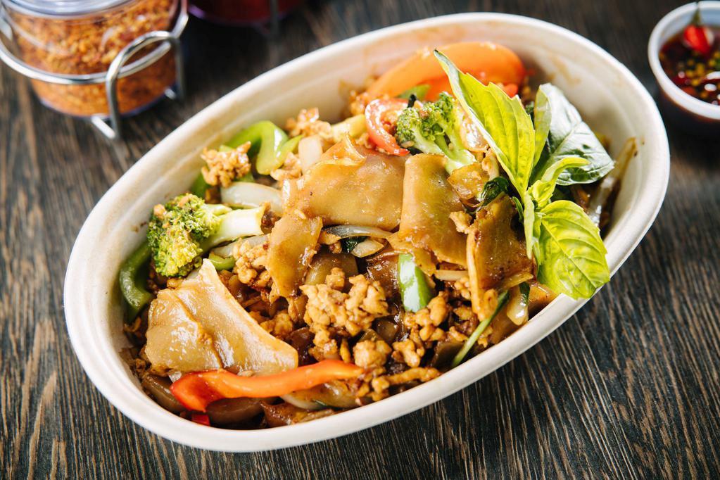 20. Pad Kee Mao | Drunken Noodles · Thick flat noodles with egg, Thai basil, white onions, tomatoes, bell peppers, broccoli.