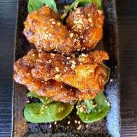 Chicken Wings · crispy brined wings, spicy soy garlic glaze, sesame seeds