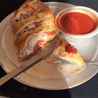 Stromboli · Includes ham, pepperoni and mozzarella cheese wrapped in our homemade dough. 