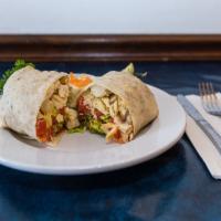 Chicken Caesar Wrap · Marinated grilled chicken, lettuce, tomatoes, Parmesan cheese, and Caesar dressing. Served w...
