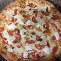 Caprese Pizza · Tender Buffalo mozzarella cheese and tomatoes topped with fresh basil.