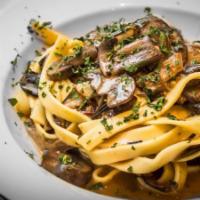 FETTUCCINE WITH WILD MUSHROOMS AND TRUFFLE OIL · FETTUCCINE ai FUNGHI	
Wild Mushrooms & Truffle Oil