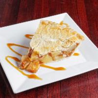 Apple Pie French Toast Ala Mode · Full-stack of our french toast topped with apple pie filling, scoop of ice cream, topped wit...