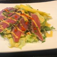 Pepper tuna & mango salad · Seared pepper tuna, mango, house garden salad seved with chef' onion dressing, spicy mayo, m...