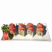 H11. Mountain Roll · Avocado and cucumber with crunch inside, topped with tuna and spicy sauce. Eight pieces.