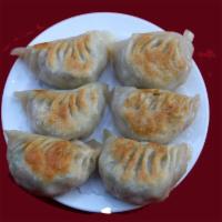 38. Pan Fried Dumplings · 6 pieces.