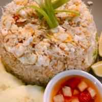 P1. Crab Fried Rice · (GF*)Fried rice topped with egg, stir fried with crab meat and chopped green onion. 
Served ...