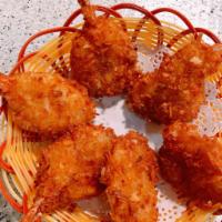 A7 Coconut Shrimp (Six pieces) · Individual shrimp dipped in coconut batter.
Then rolled in an aromatic combination of coconu...