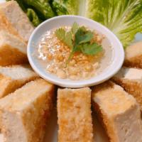 A11. Tofu Delight · (GF*)Hand battered with flour deep fried firm tofu serve with crushed peanut sweet and sour ...