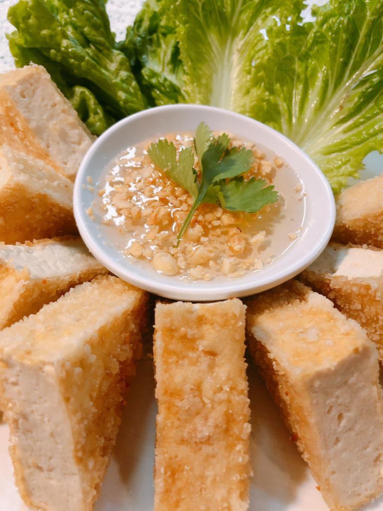 A11. Tofu Delight · (GF*)Hand battered with flour deep fried firm tofu serve with crushed peanut sweet and sour sauce.