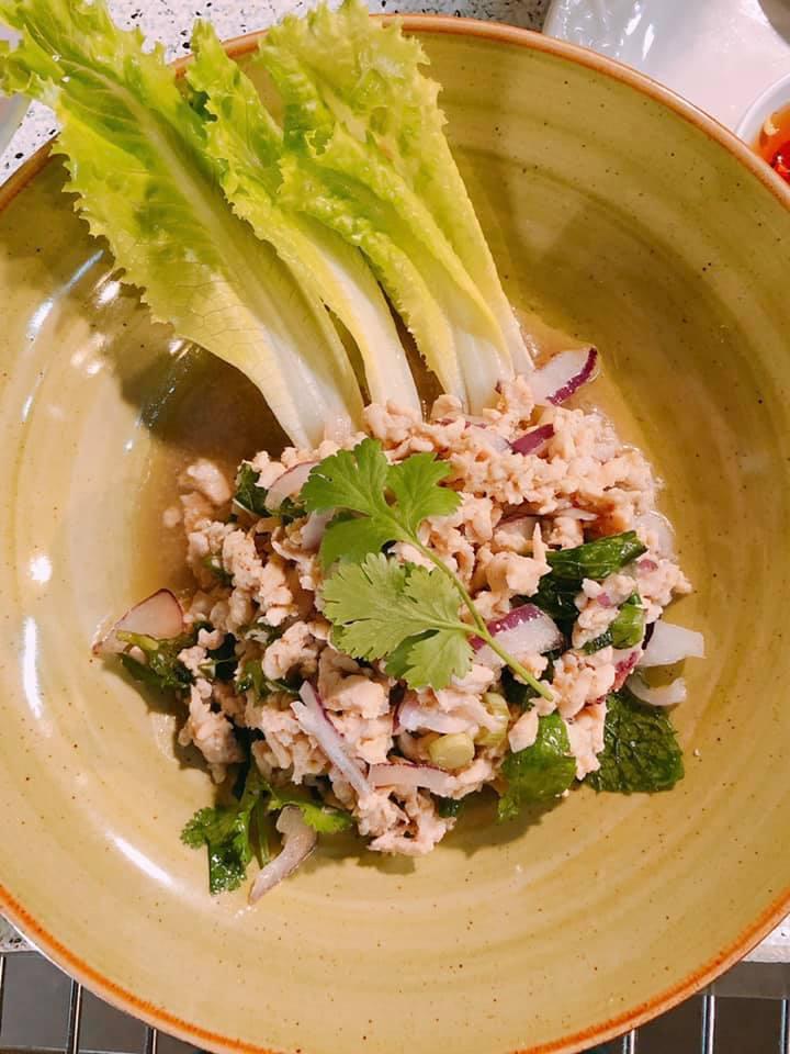 Larb Salad · (GF*) Choice of ground chicken, ground pork or ground beef (+$1), tossed with chopped green onion,
cilantro, mint, red onion, *fish sauce, lime juice, sweet syrup and rice powder, served with lettuce,
cucumber and jasmine rice on the side.